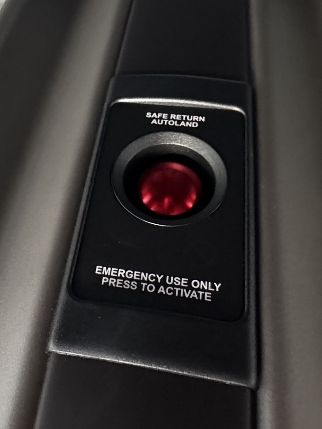 Safe Return autoland activation button in the cabin