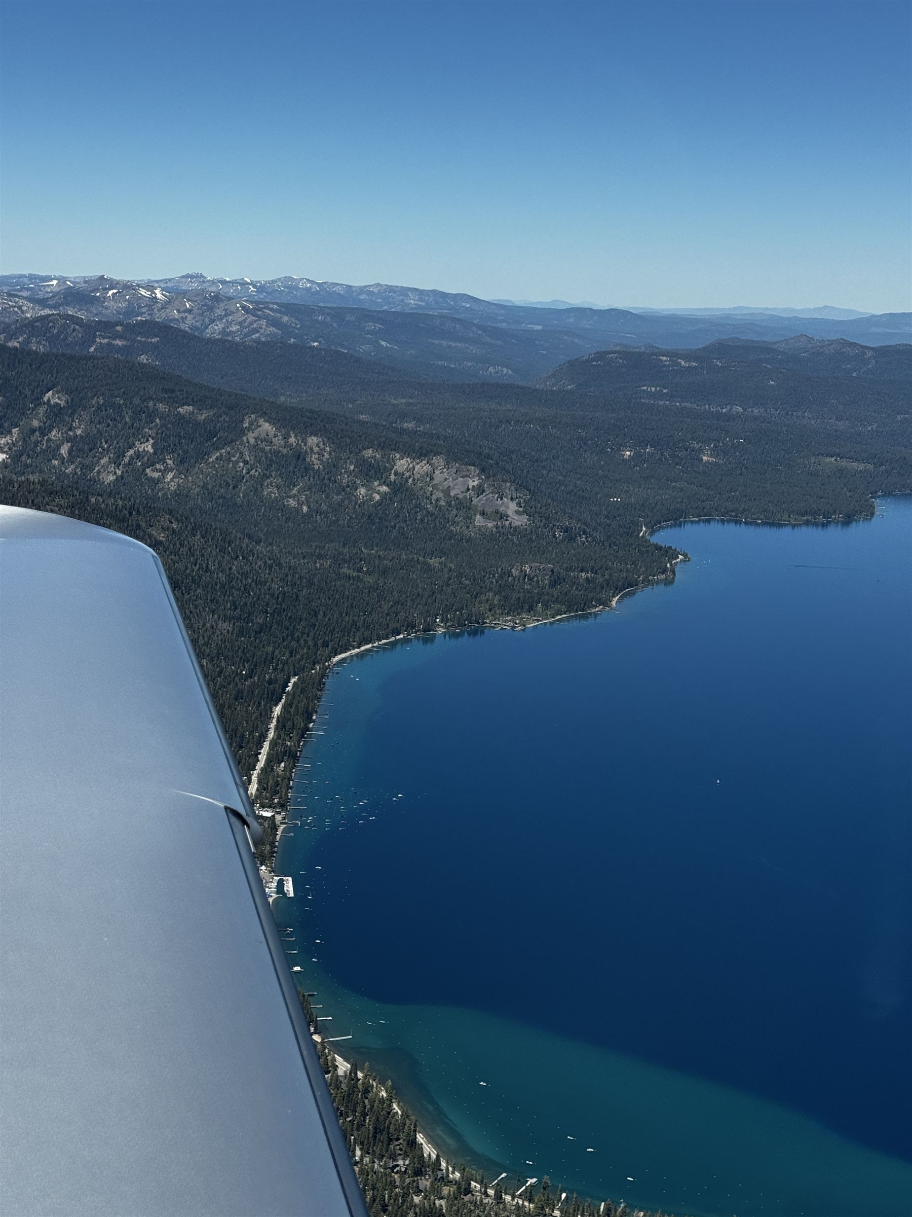 Over the wing, en route above the water